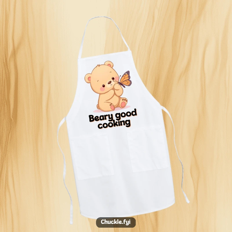 Funny apron showcasing a bear cub gently tickling a butterfly with its paw, ideal for a baker who loves cute and wholesome designs.