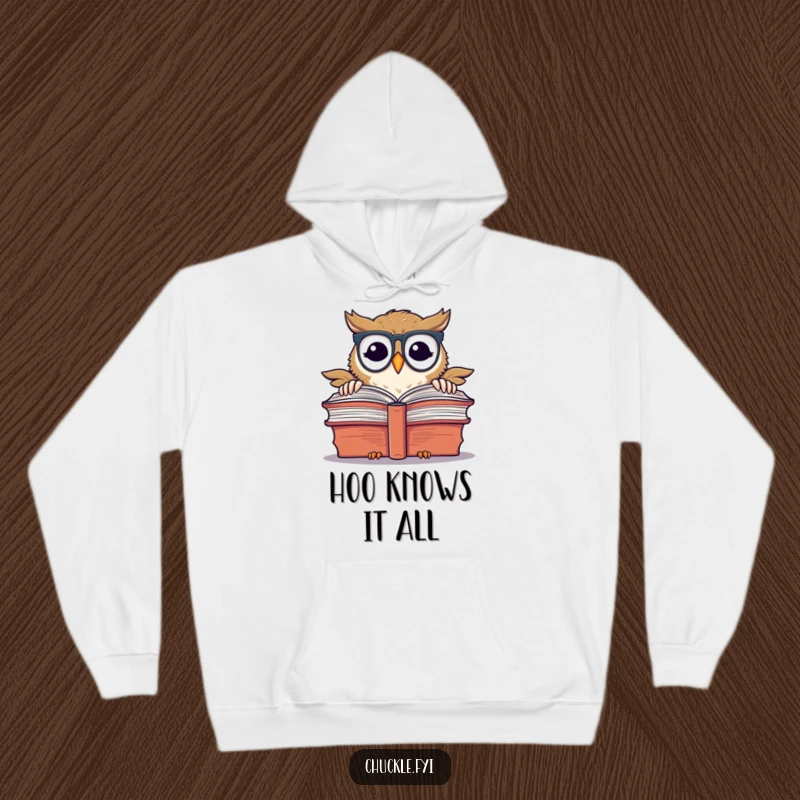 Funny chuckling owl wearing spectacles, peeking over a giant book, on a cozy hoodie.