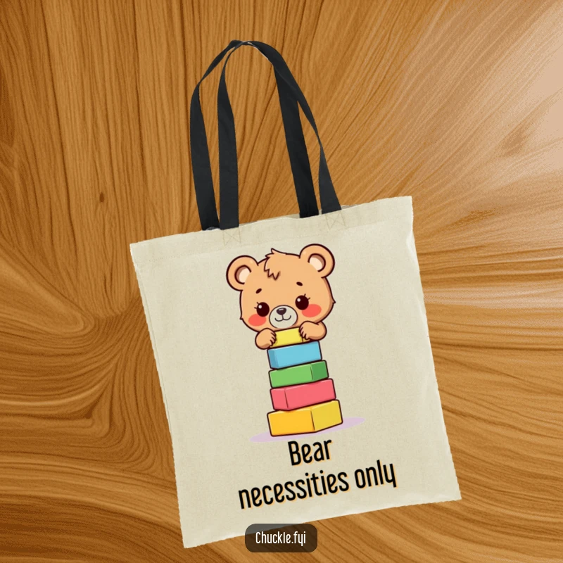 Funny bear cub tote bag showing a small, brave bear cub concentrating hard on balancing a wobbly stack of colorful blocks.